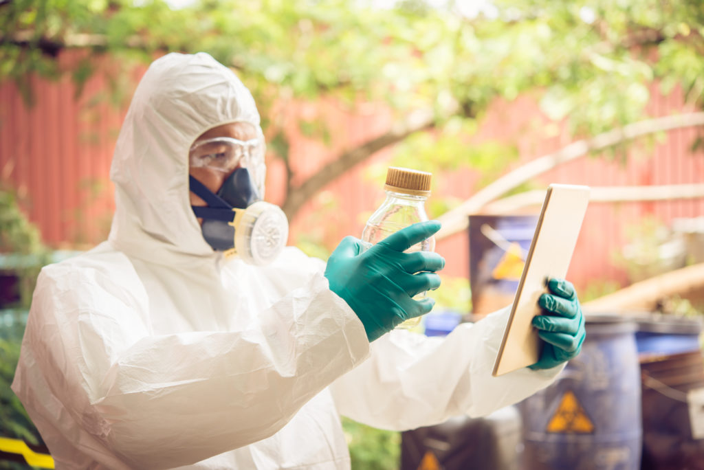 Asian scientist wear Chemical protection suit check danger chemical ...